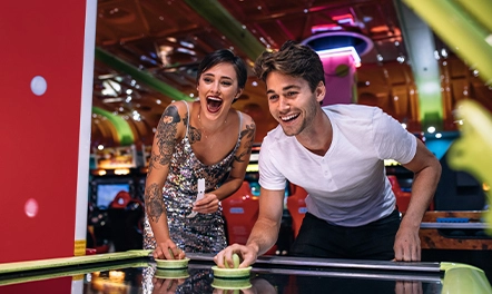 gamer couple playing arcade games 